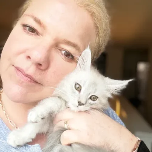 Lucy Appel Bellspurr Breeder Holding a Black Silver Shaded Maine Coon Kitten